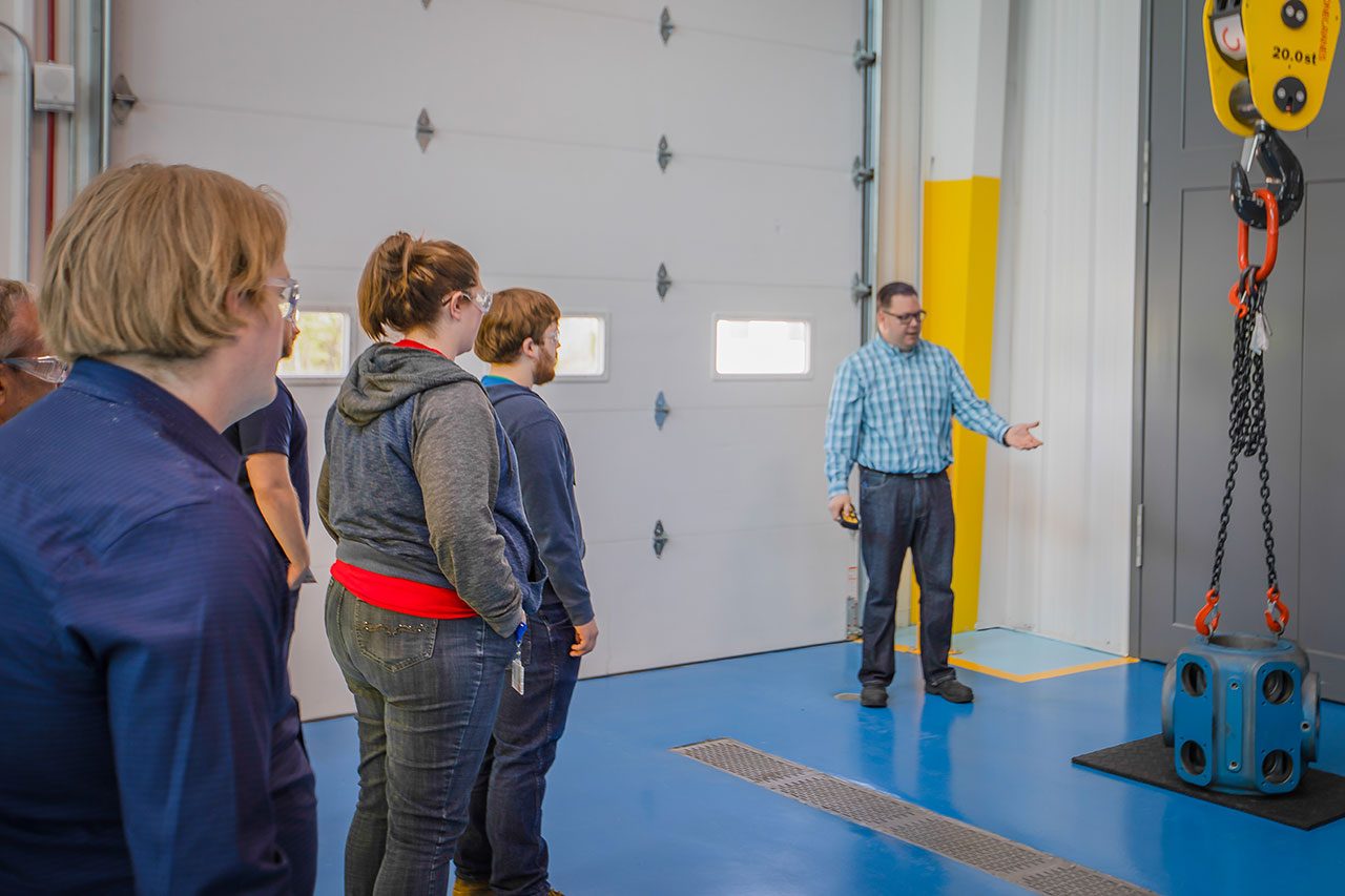 Ariel safety instructor demonstrates safe crane operation to students at the Ariel Training Center