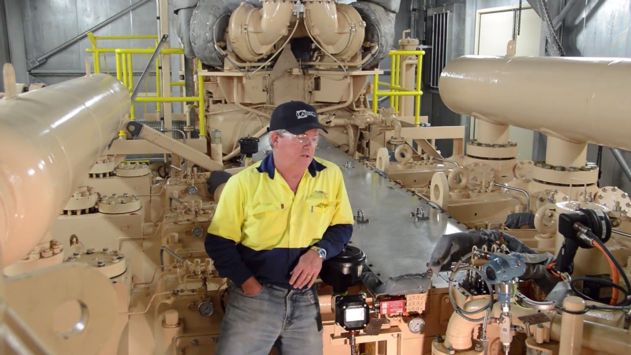 A Mondara Team Leader on a compressor at the Mondara storage facility