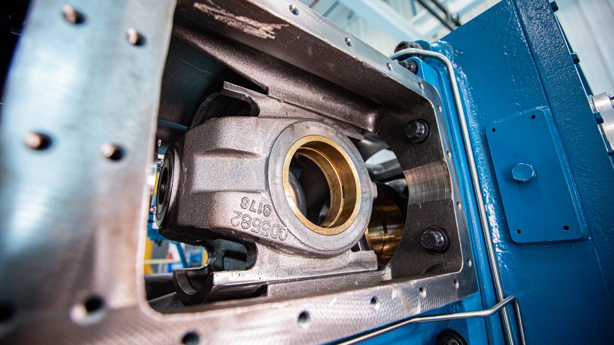 An ariel crosshead seen from the open guide door of a compressor