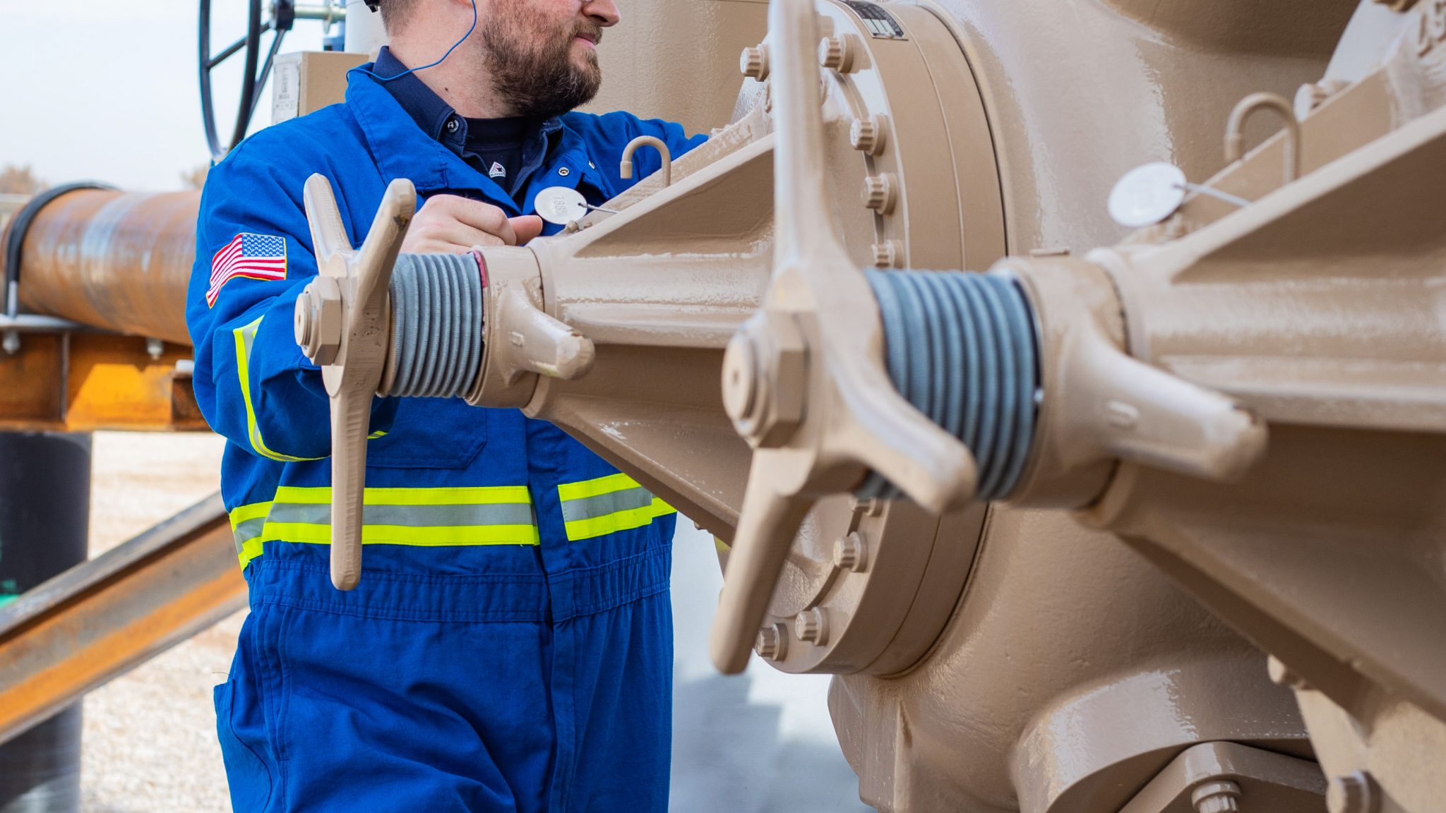 Two VVCPs on a compressor with an ariel technician inspecting