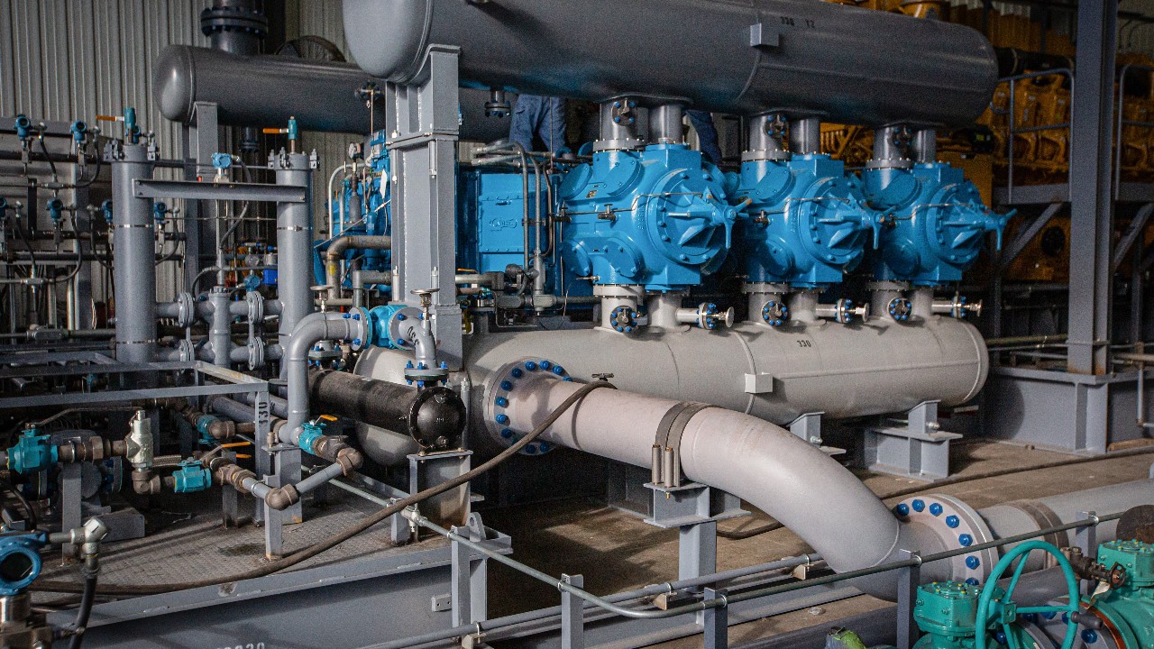 A blue ariel compressor connected in a package at a packager facility