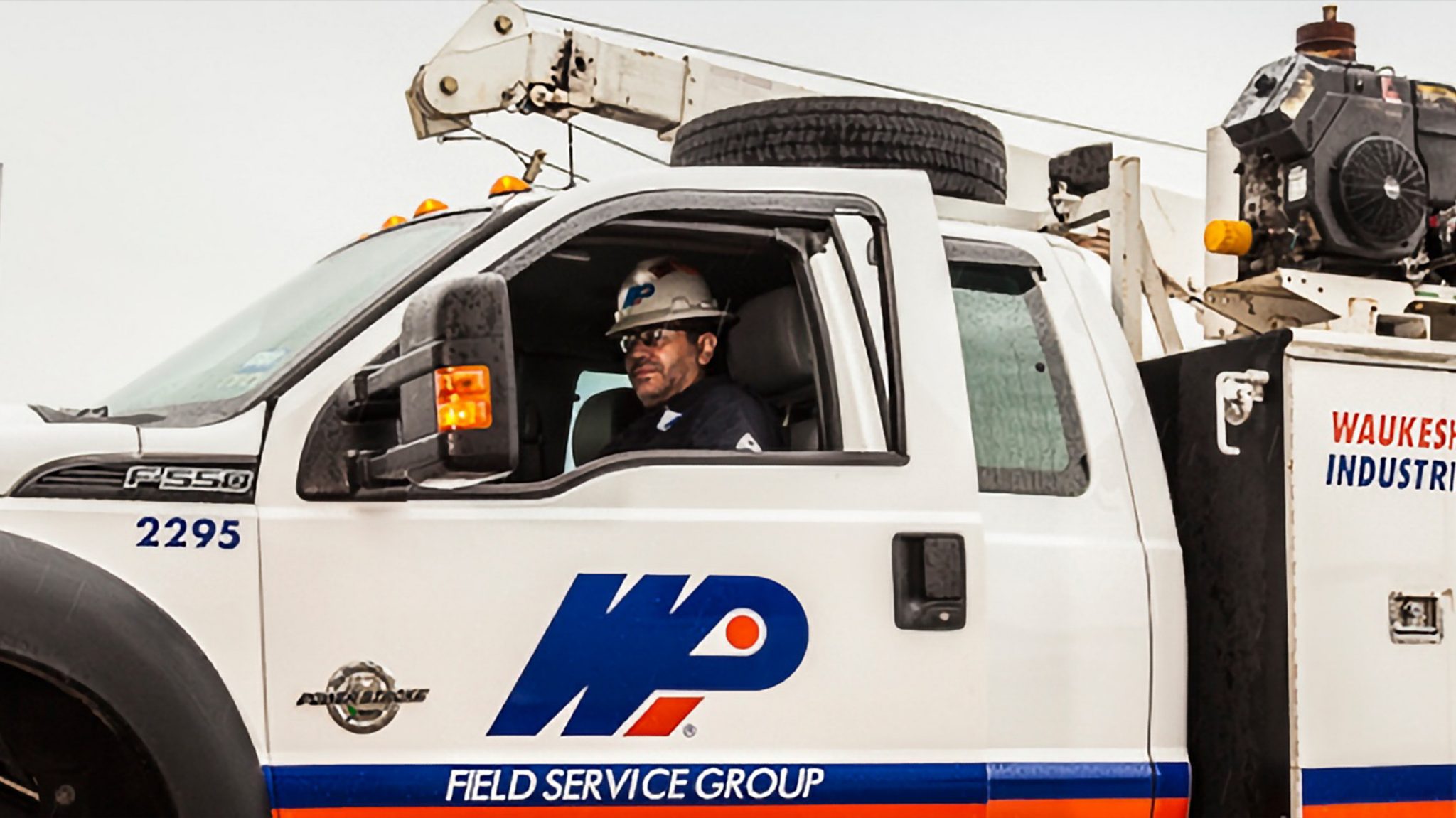 A WPI Field Service Employee getting out of a WPI Truck